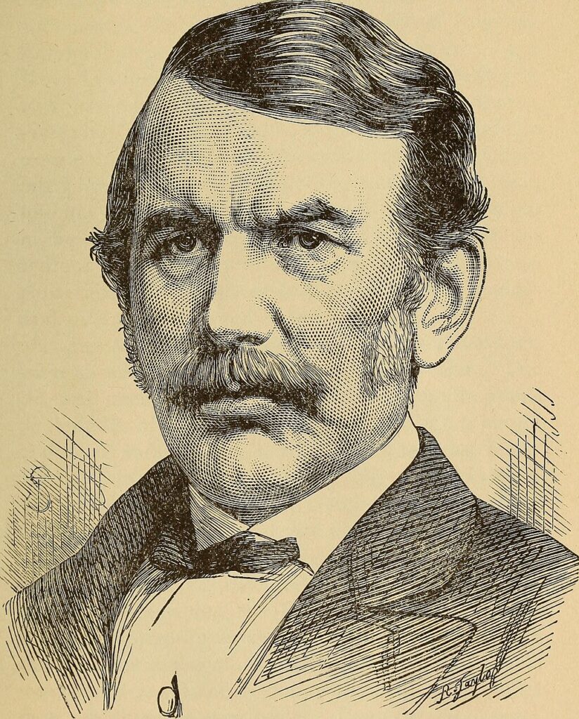 Historisches Porträt eines Mannes mit Schnurrbart im Anzug, als feine schwarz-weiße Stichillustration dargestellt.